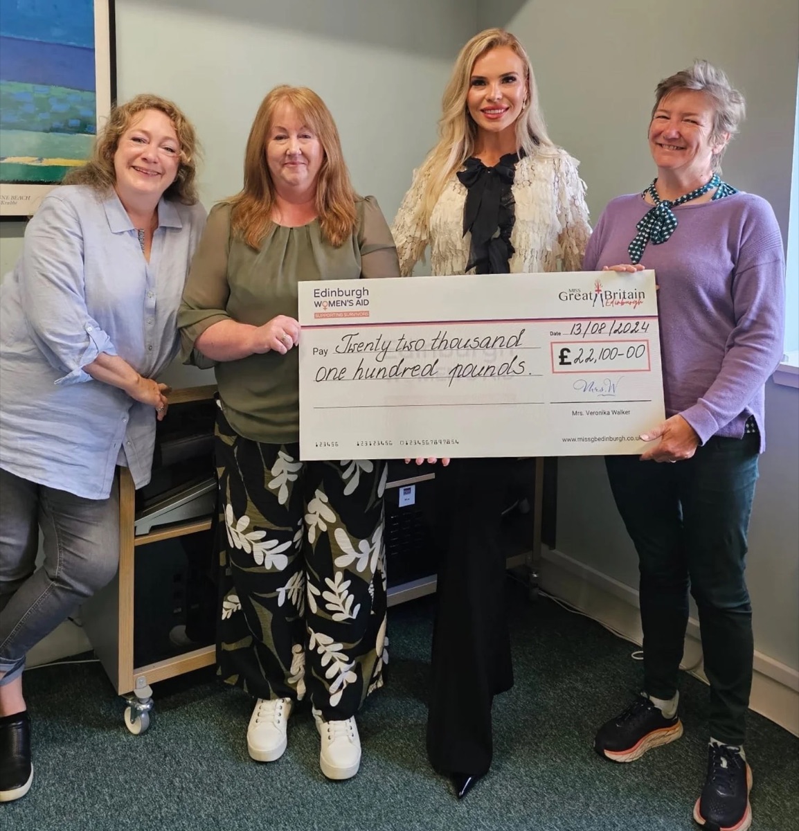 Veronika Walker presenting a fundraising cheque to Edinburgh Women’s Aid