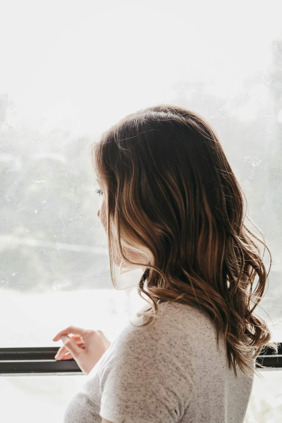 Woman looking out of a window