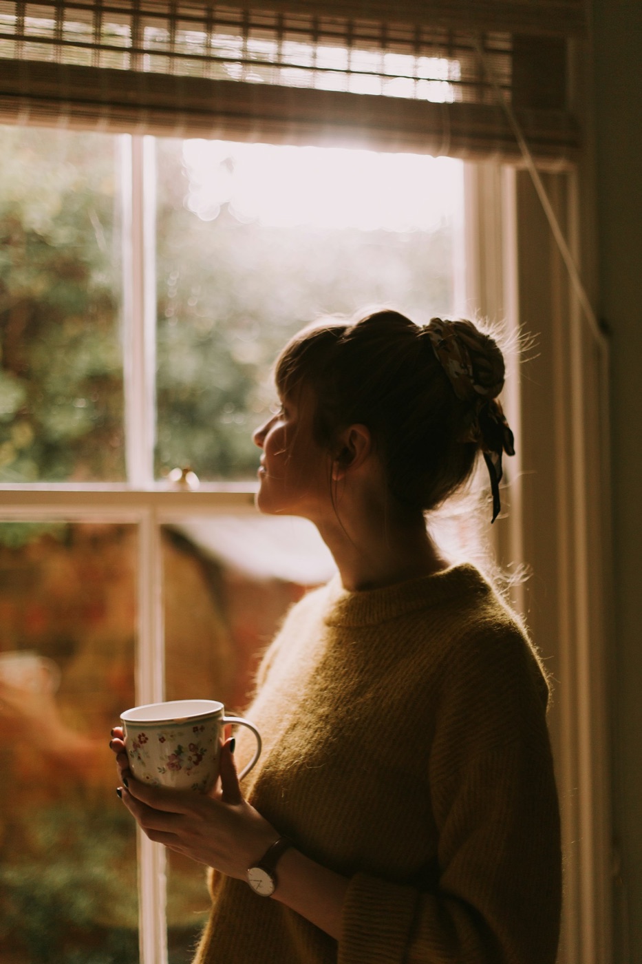 Woman by a window in natural light