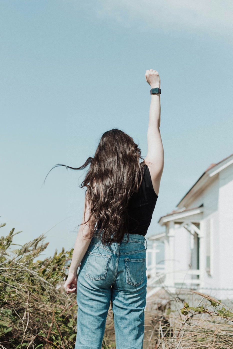 Woman with arms raised
