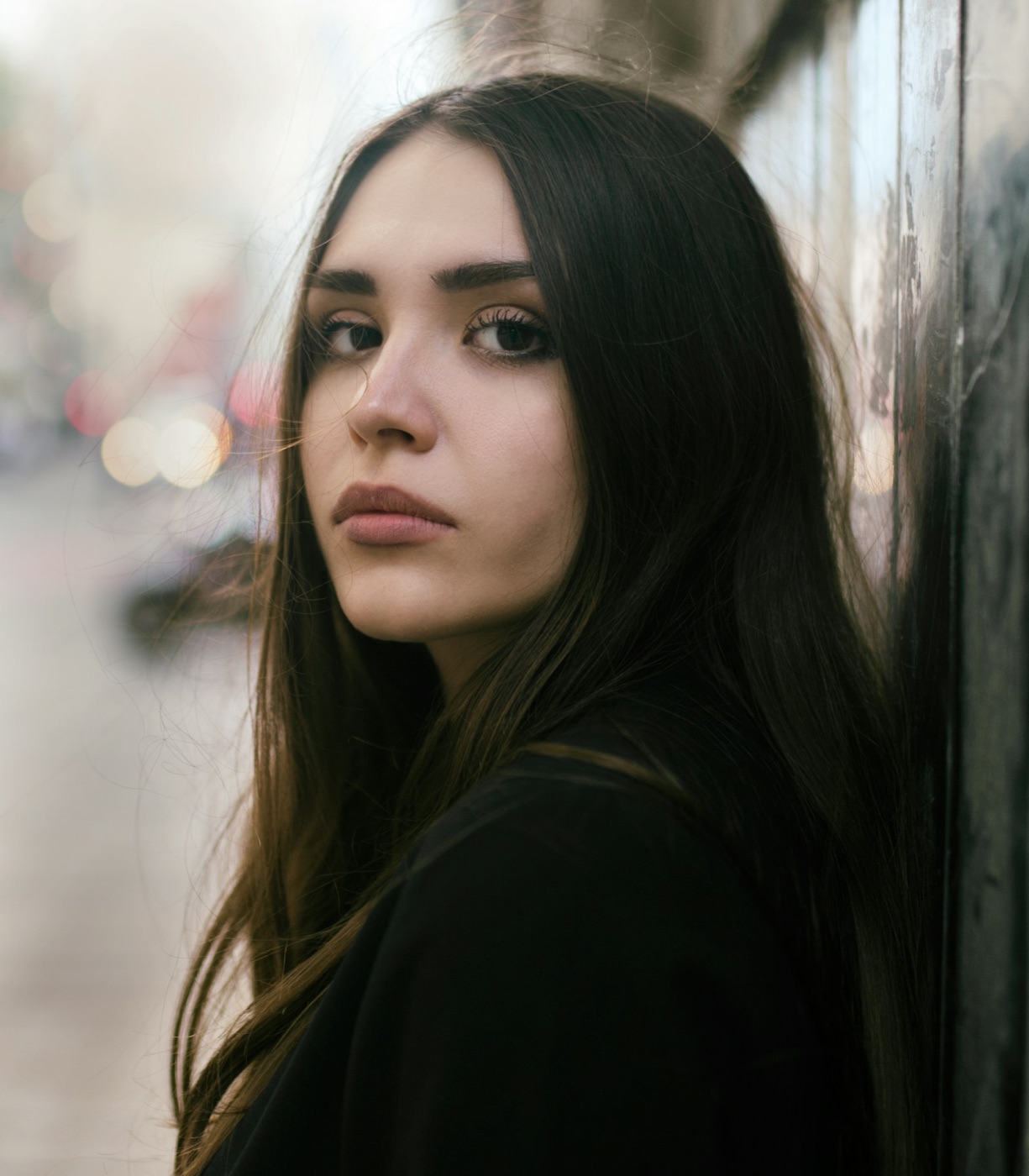Young woman, quiet and watchful